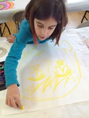 Girl draws in yellow