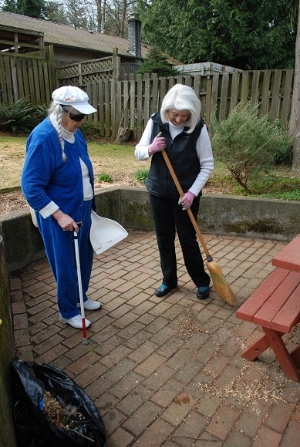 Volunteer helping to clean for a Chore client