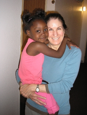 A house manager volunteer and a child