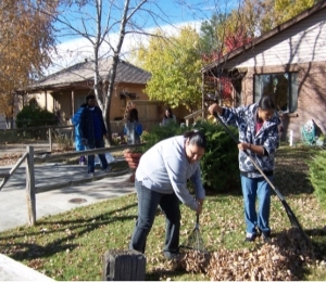 Volunteers for Make A Difference Day yard cleanup