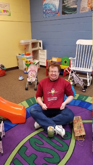 Child Care Helper in children's room