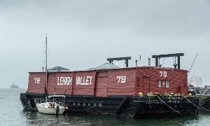 106 year old wooden barge floating in Red Hook