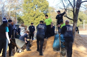 Firemen helping spread Mulch