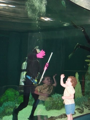 Volunteer Diver interacting with a child