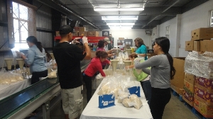 Volunteers repackaging rice
