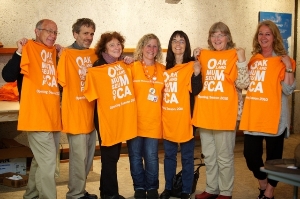volunteers in orange shirts