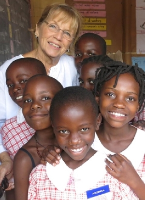 A sponsor with children at Circle of Peace School