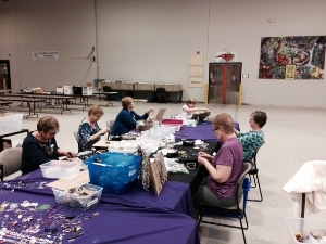 Volunteers processing jewelry