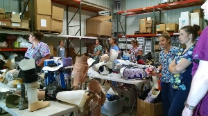 Volunteers helping sort a donation of orthotic and prostheti