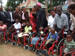 wheelchair giving to children with disabilities