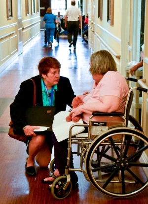 Ombudsman conversing with a senior