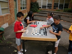 Chess kids thinking about the next move.